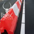 Red and white 1 metre Euro barrier linked in a line on a road