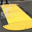 Yellow and black GRP road plate laid on a road