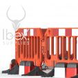 Orange road rock barriers with red and white blocks on white background