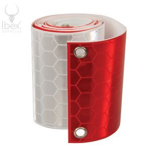 Roll of red and white Fencebrite reflective stips on a white background