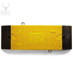 Aerial view of yellow and black GRP road plate on white background