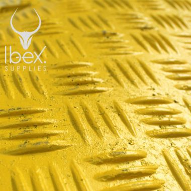 Close up of yellow speed ramp mid section tread pattern